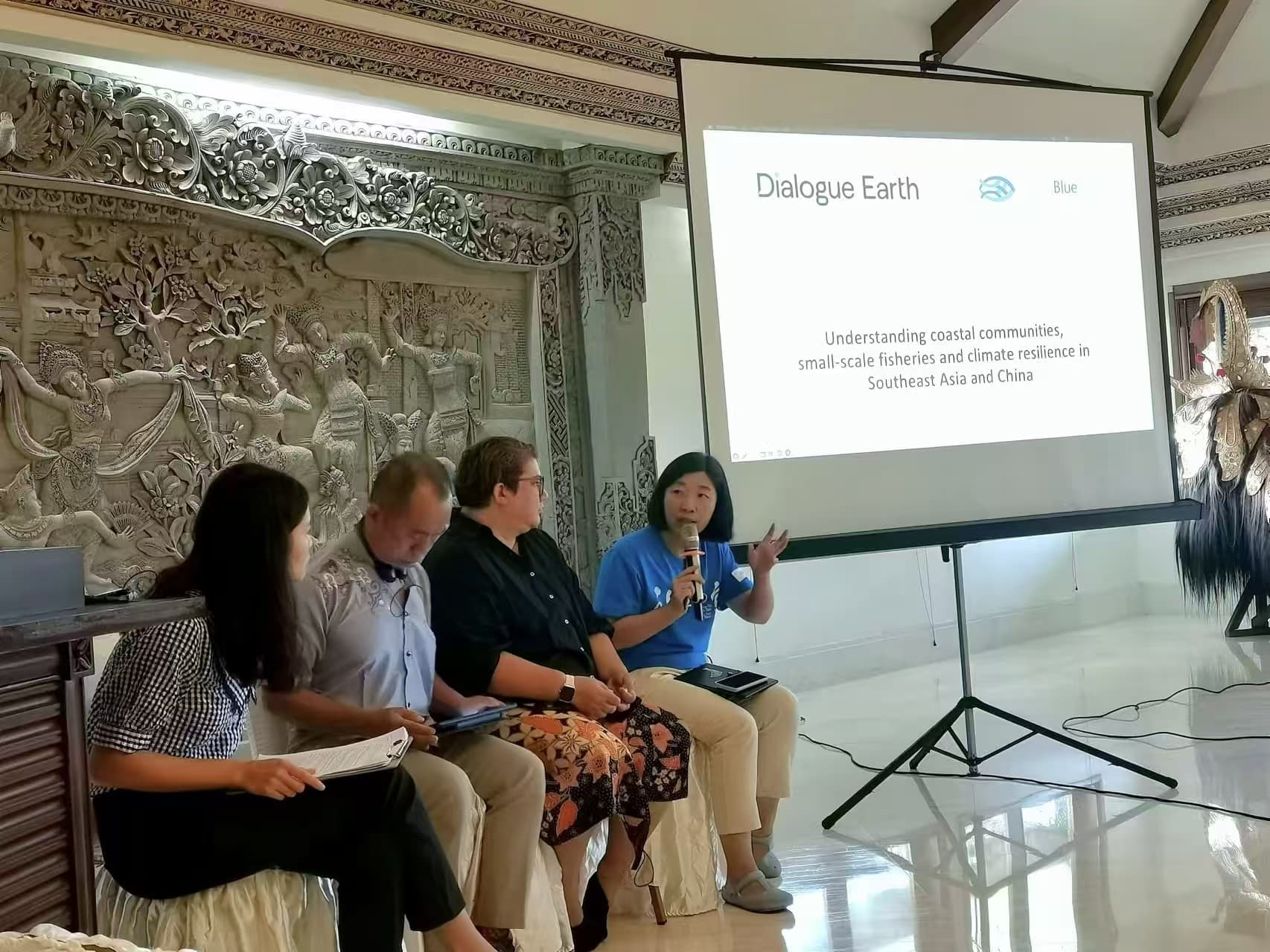 2024 Bali Workshop - participants in discussion with presentation screen