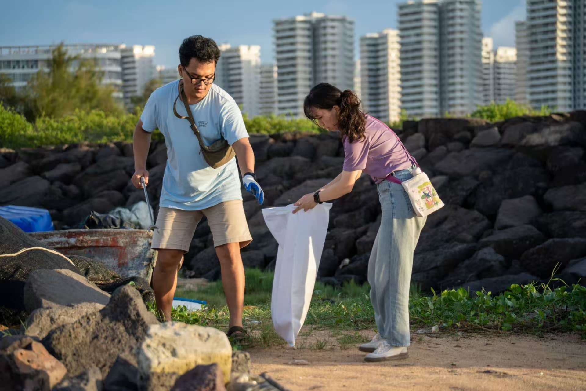 Beach cleanup activity with participants collecting marine debris